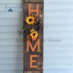 A fall wood sign that says Home on it.