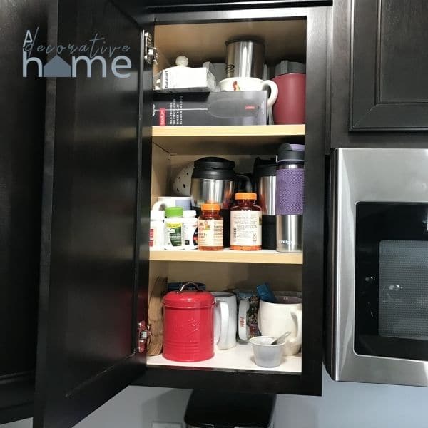 Organize a coffee cupboard before look of a messy cupboard