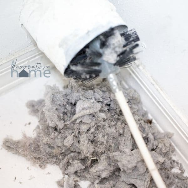 Winterizing your home by cleaning out the dryer vent.