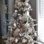 A silver, white, and black Christmas tree to share more decorating tips and tricks.